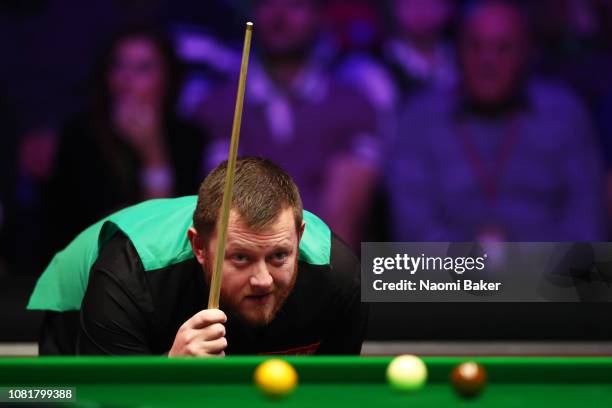 Mark Allen of Northern Ireland prepares to play a shot during his first round match against Luca Brecel of Belgium during day one of The Dafabet...