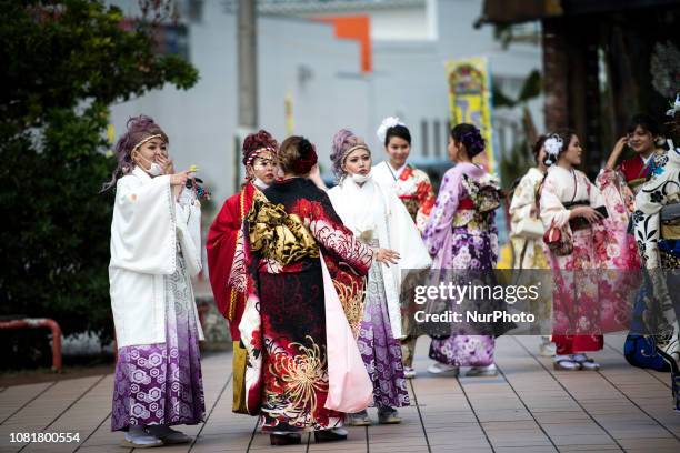 Japanese new adults wearing kimonos celebrates the Coming of Age Day celebration in Chatan, Okinawa City, Japan on January 13, 2019. The Coming of...