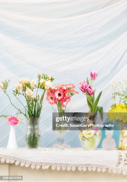 variety of flowers in different vintage and antique vases - freesia flowers stock pictures, royalty-free photos & images