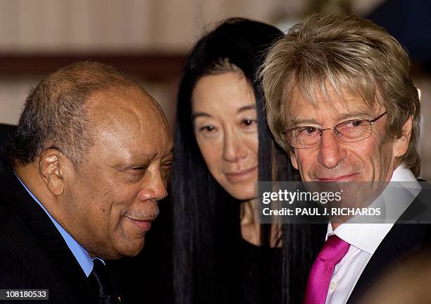 Music producer Quincy Jones clothing designer Very Wang , and Eddie Trump share a few words during the US Department of State luncheon for Chinese...
