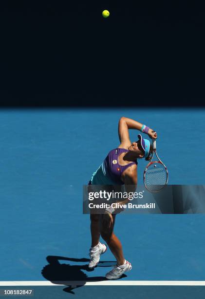 Nadia Petrova of Russia serves in her second round match against Alicia Molik of Australia during day four of the 2011 Australian Open at Melbourne...