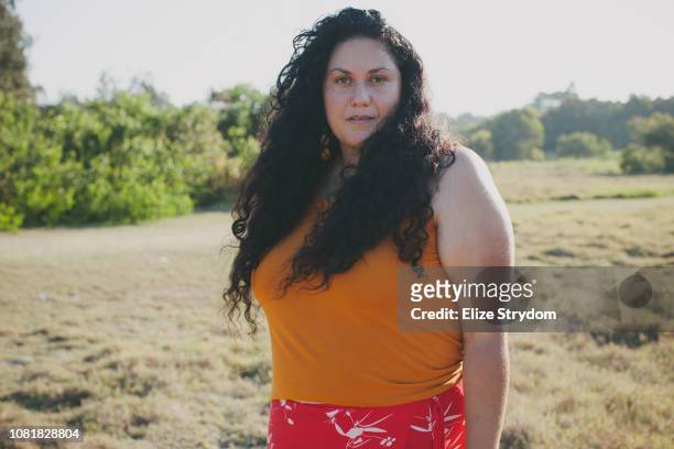 aboriginal woman in a field - determination outdoors stock pictures, royalty-free photos & images
