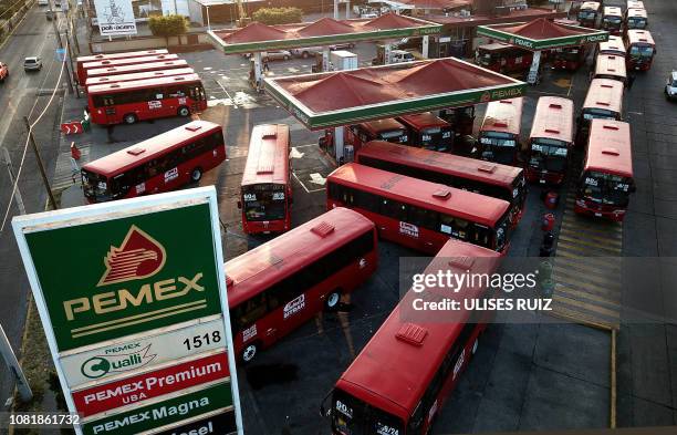 Buses queue at a Pemex gas station in Guadalajara, Jalisco State, Mexico, on January 13, 2019. Earlier this week President Andres Manuel Lopez...