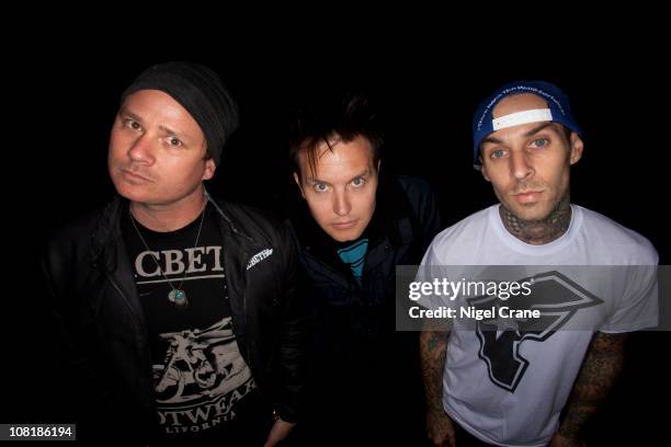 Tom Delonge, Mark Hoppus, Travis Barker of Blink 182 pose for a photoshoot on August 29, 2010 in Reading, England.