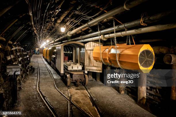 hard coal mine underground corridor with steel support system and electrical equipment - mining stock pictures, royalty-free photos & images