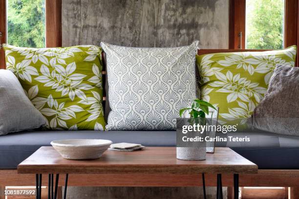 coffee table in a stylish modern living room - sofa table stock pictures, royalty-free photos & images