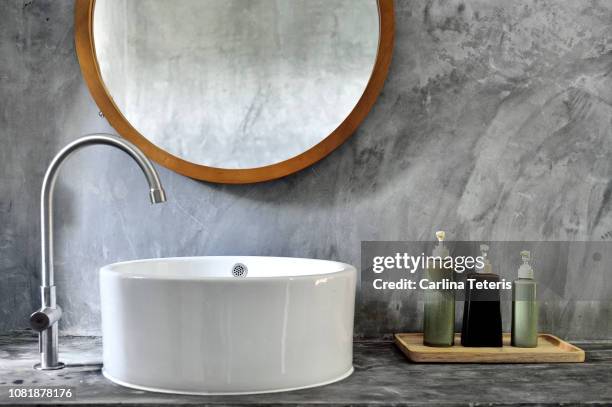 stylish bathroom vanity with modern sink - sink foto e immagini stock