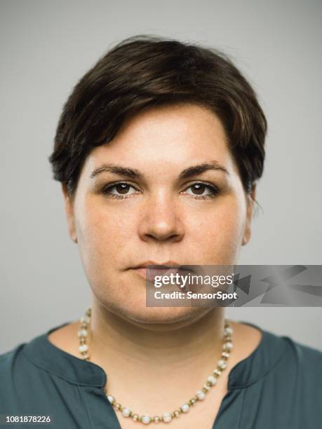 real caucasian adult woman with blank expression - short hair for fat women stock pictures, royalty-free photos & images