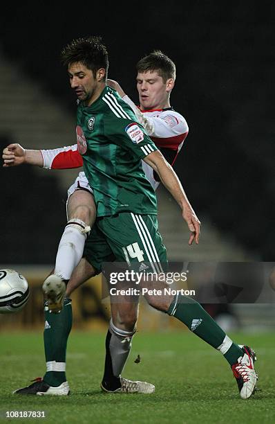 Rory Fallon of Plymouth Argyle contests the ball with Gary Mackenzie of MK Dons during the npower League One match between MK Dons and Plymouth...