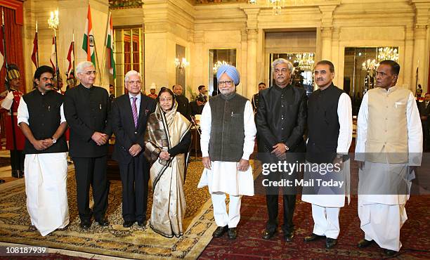 President Pratibha Patil and Prime Minister Manmohan Singh with newly sworn-in ministers, left to right, KC Venugopal, Salman Khurshid, Ashwani...