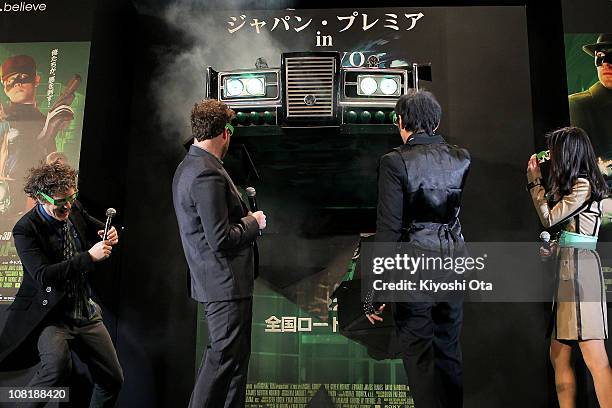 Director Michel Gondry, actor and producer Seth Rogen, actor Jay Chou and actress Ryoko Shinohara react as a model of the Black Beauty car apprears...