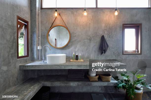 vanity in a luxury concrete bathroom - bathroom ストックフォトと画像