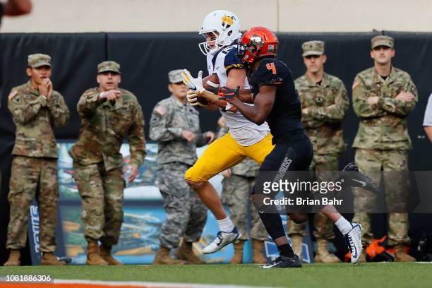 Wide receiver David Sills V of the West Virginia Mountaineers pulls in a 22-yard touchdown catch against cornerback A.J. Green of the Oklahoma State...