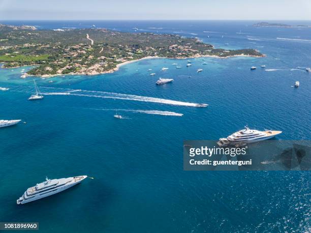 aerial view of the famous costa smeralda, sardinia, italy. - luxury yacht stock pictures, royalty-free photos & images