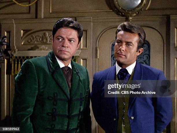 Ross Martin as Artemus Gordon and Robert Conrad as James T. West in "The Night of the Eccentrics," season 2, episode 1 of THE WILD WILD WEST....