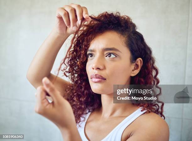 i have to get a product that's less damaging - strand of hair stock pictures, royalty-free photos & images