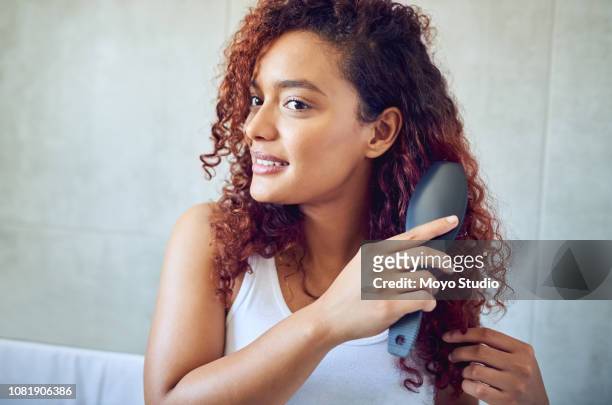 it you treat your hair, you'll never have bad hair days - brush in woman's hair imagens e fotografias de stock