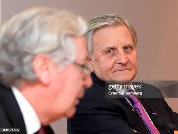 Jean-Claude Trichet, chairman of the European Systemic Risk Board , right, listens as Mervyn King, first vice-chairman of the ESRB, pauses during a...