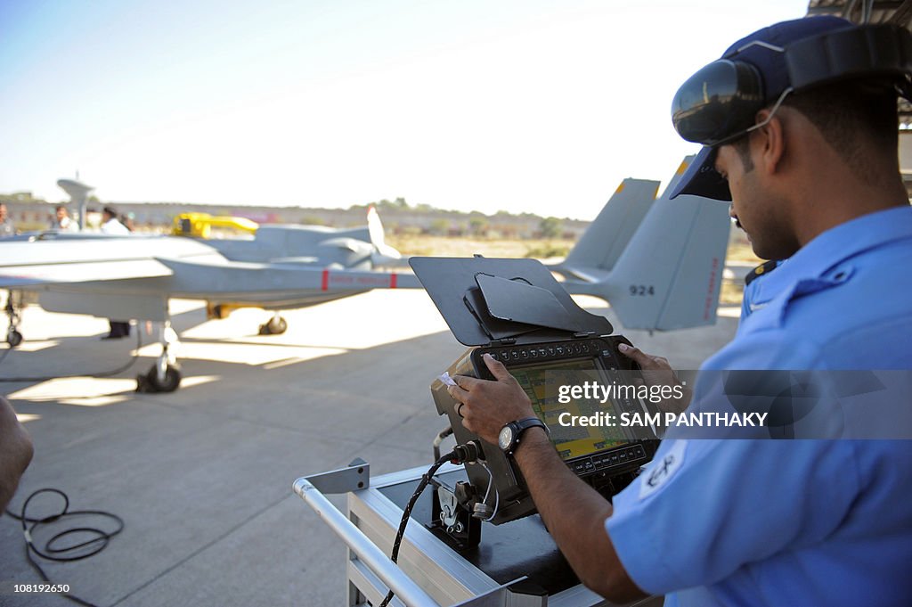 An Indian Navy technician prepares a "He