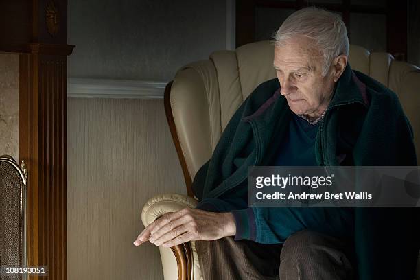 senior man feeling the cold in his home - hull uk stock pictures, royalty-free photos & images