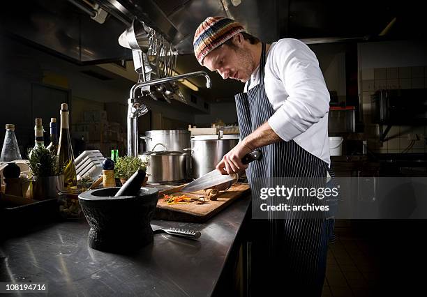 a cook preparing a meal in the dark - kockar bildbanksfoton och bilder