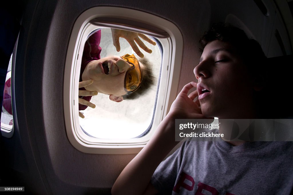 Man Stuck In Window Man Sleeping On An Airplane With A Skydiver Stuck On Window High-Res ...