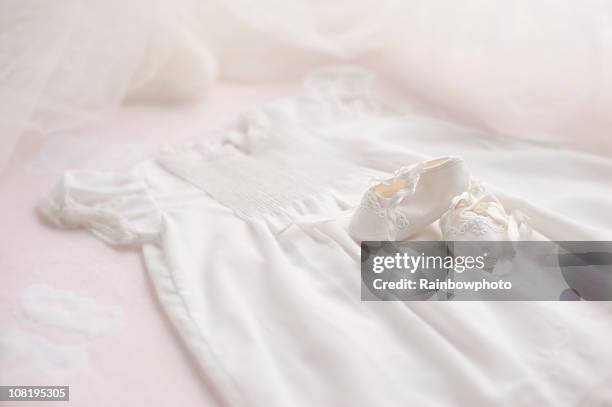 baptism gown with booties &amp; bonnet - dopen stockfoto's en -beelden