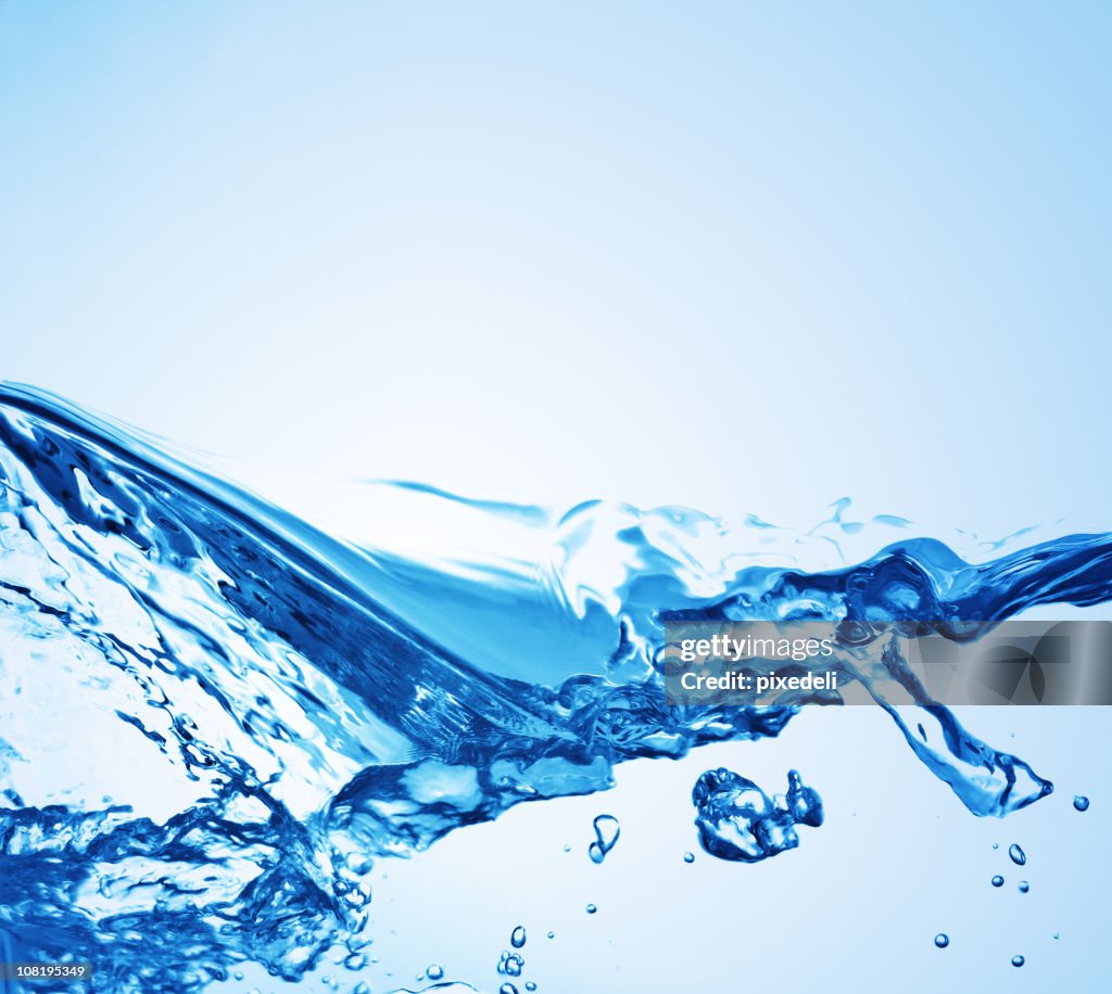 Water splashing on a blue background 