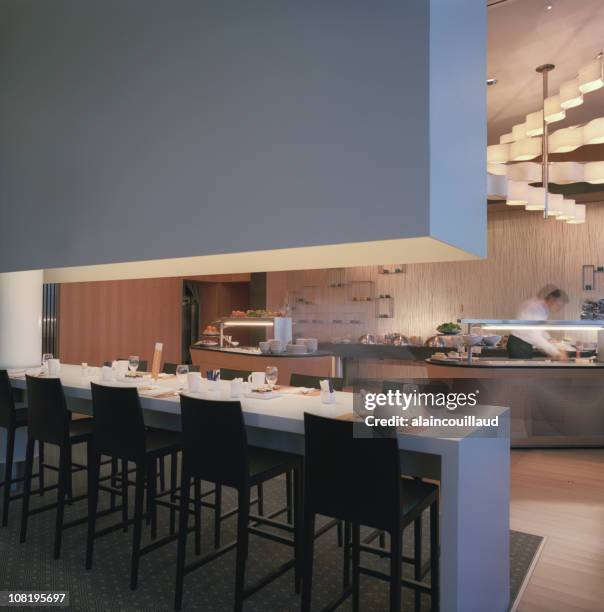 modern restaurant interior with bar facing kitchen - cocktails bar lounge stockfoto's en -beelden