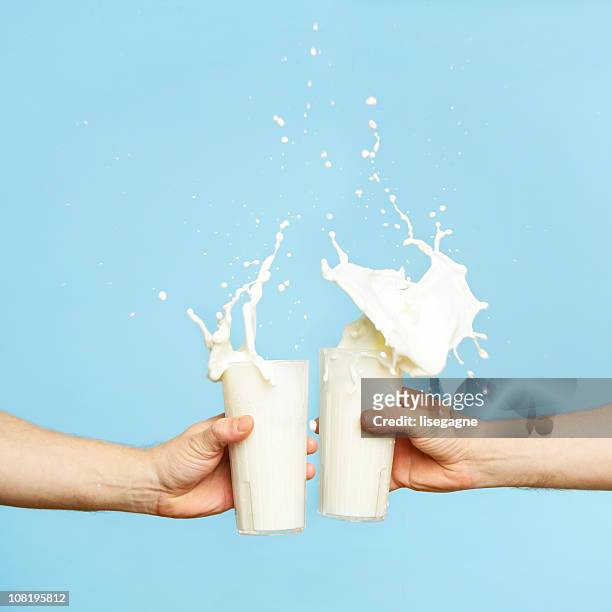 toasting with milk glass - drink stock pictures, royalty-free photos & images