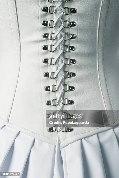 back of white leather corset ties - leather dress stockfoto's en -beelden
