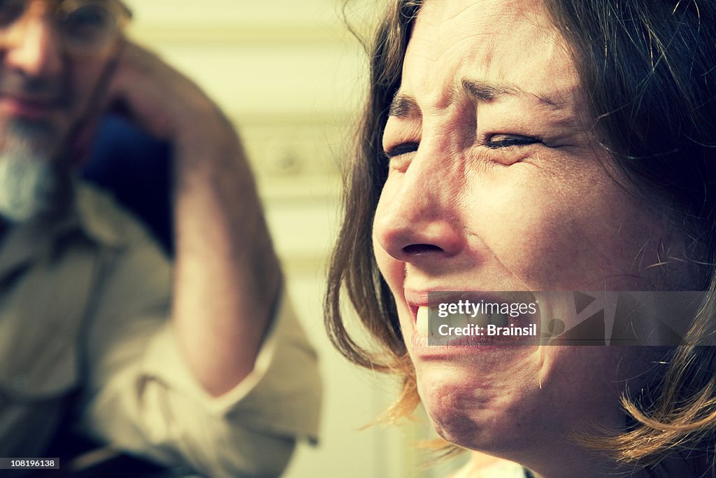 Woman Crying Interview Young Woman Crying With Man Listening In Background High-Res Stock ...