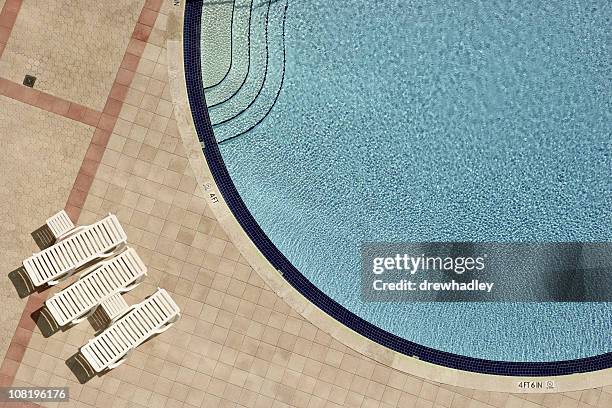swimming pool and lounge chairs - lounge chair top view stock pictures, royalty-free photos & images