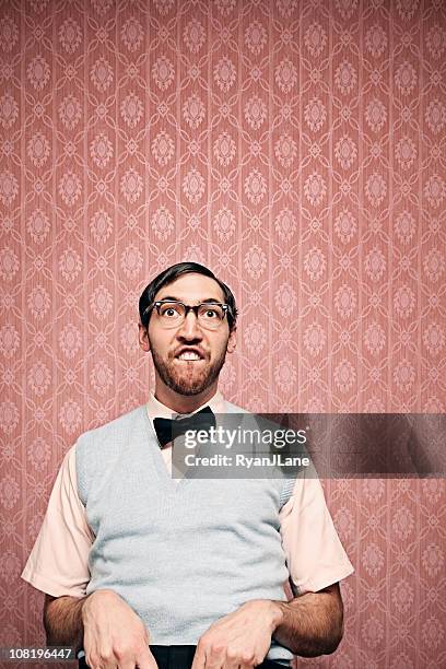 nerd student making a funny face with copy space - thick rimmed spectacles stock pictures, royalty-free photos & images