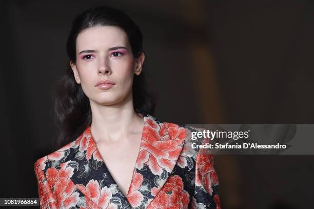 Model walks the runway at the John Richmond show during Milan Menswear Fashion Week Autumn/Winter 2019/20 on January 13, 2019 in Milan, Italy.