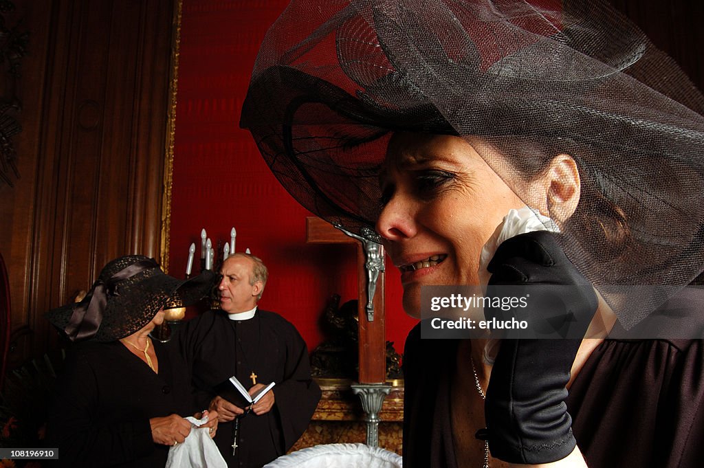 Crying Widow Dressed in Black at Funeral