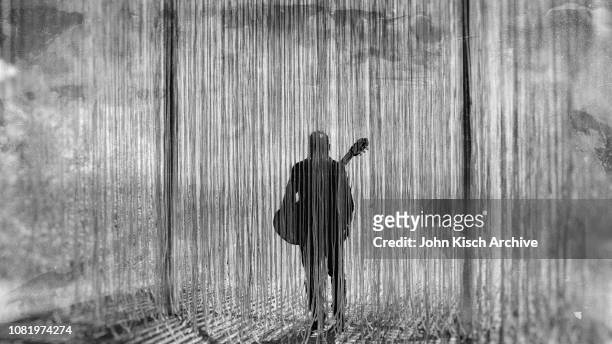 Silhouette of Mexican musician Gil Gutierrez and his guitar as he stands behind the 'Penetrable' sculpture at Olana State Historical Site in the...