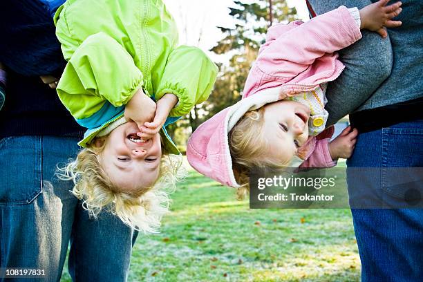 upside down - holding upside down stock pictures, royalty-free photos & images