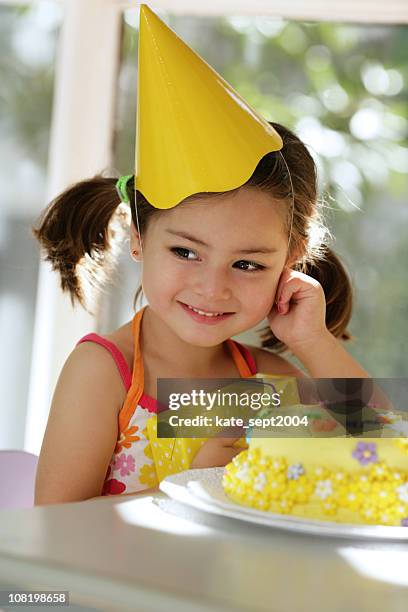 little girl's birthday - yellow hat stock pictures, royalty-free photos & images