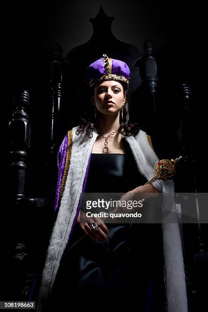 black throne with beautiful queen holding scepter - royalty throne stock pictures, royalty-free photos & images
