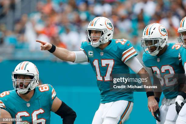 Ryan Tannehill of the Miami Dolphins reacts against the New England Patriots at Hard Rock Stadium on December 9, 2018 in Miami, Florida.