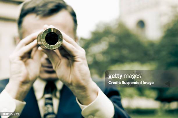 man looking through telescope - looking through telescope stock pictures, royalty-free photos & images