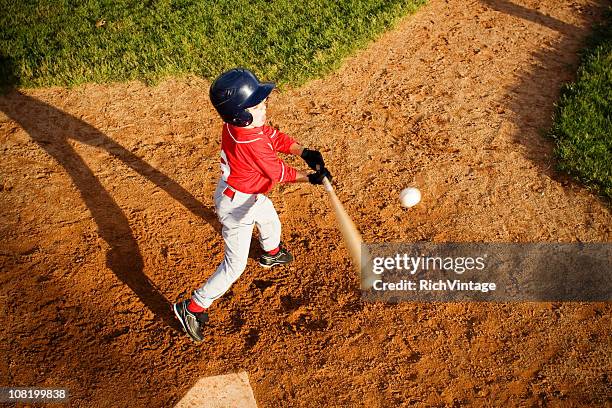 ball in play - hitting child stock pictures, royalty-free photos & images