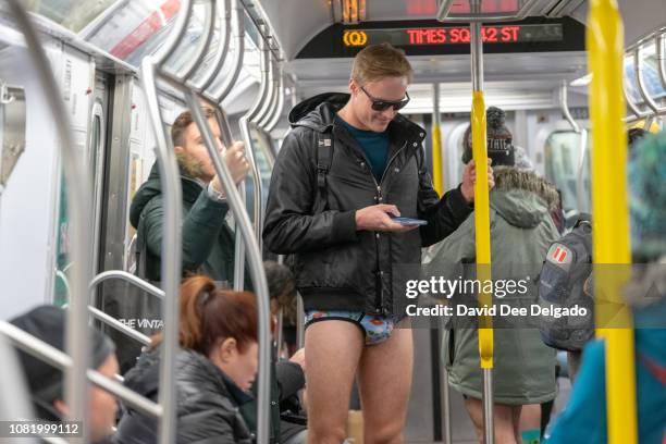 Participants ride the F subway line during the 18th annual No Pants Subway Ride on January 13, 2019 in New York City. 24 cities participate in the...