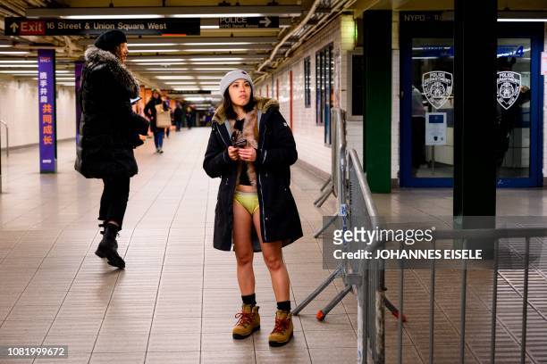 Participants in the 18th Annual "No Pants Subway Ride" travel in the subway on January 13, 2019 in New York. - The "No Pants Subway Ride" is an...