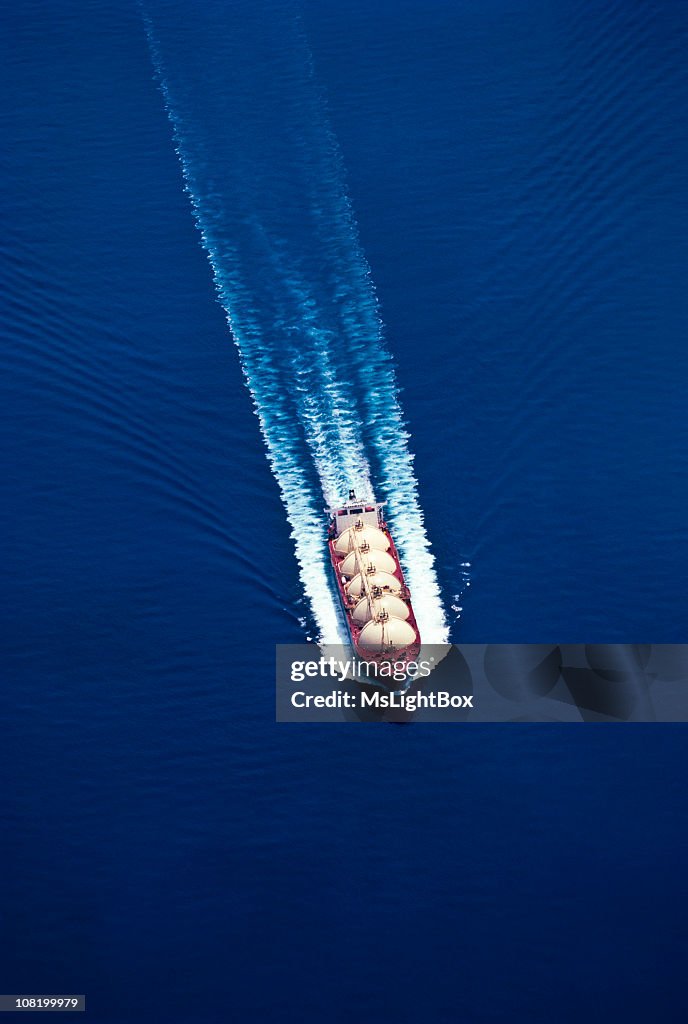 An aerial view of a boat on water for the oil industry