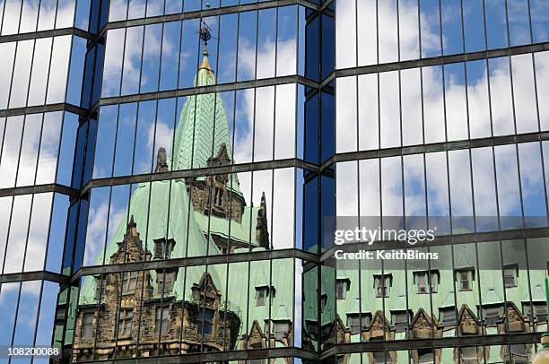 parliament building reflection on glass - canada parliament stock pictures, royalty-free photos & images