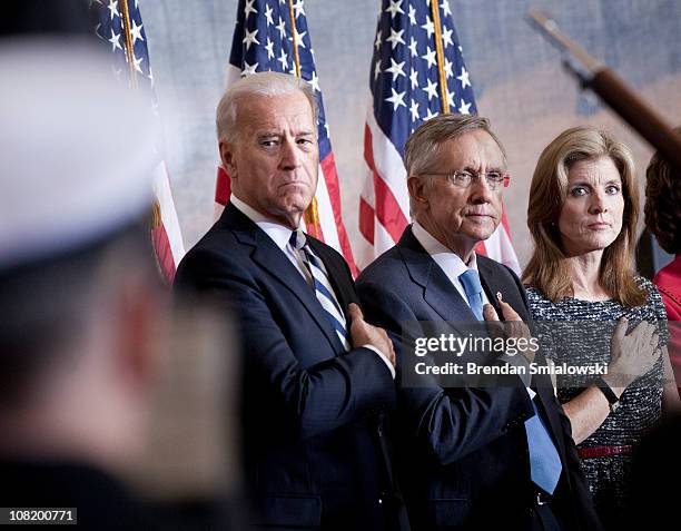 Vice President Joseph Biden, Senate Majority Leader Harry Reid and Caroline Kennedy listen to the national anthem during an event to honor John F....