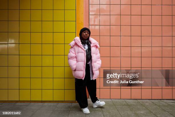 Woman stands at subway station