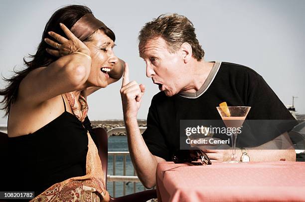 mature couple arguing on their vacation - drunk husband stock pictures, royalty-free photos & images